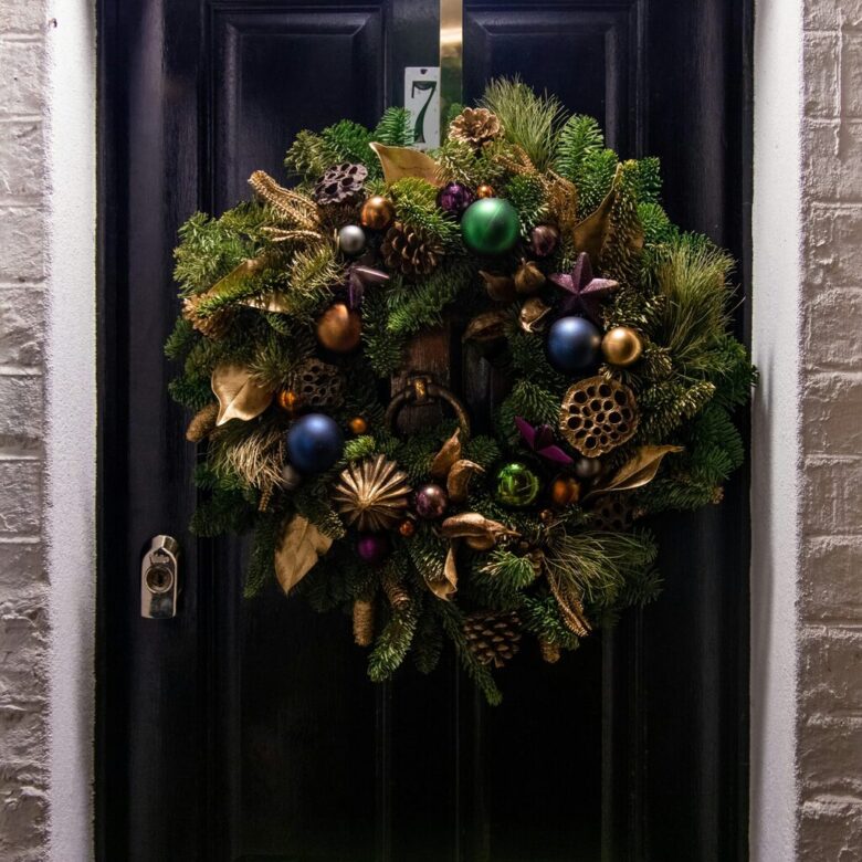 A festive composite door styled for Christmas, offering warmth, security, and seasonal charm